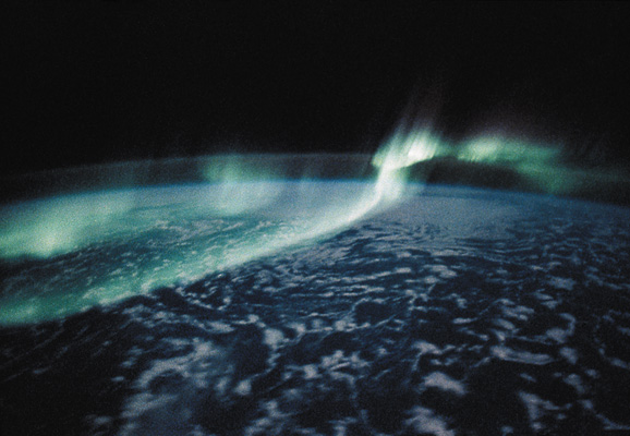 Image of aurora dancing and shimmering in Earth's upper atmosphere.