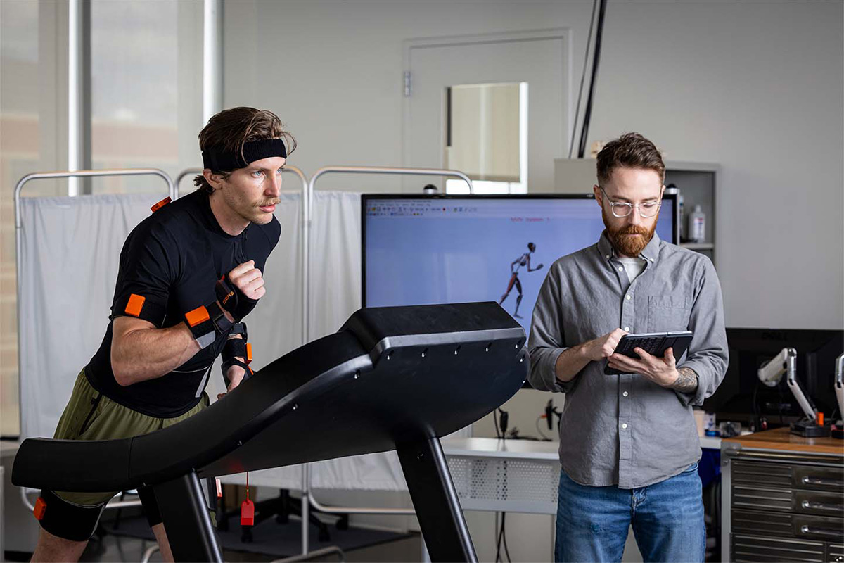 An APL researcher runs on a treadmill while another researcher monitors vitals for signs of fatigue.