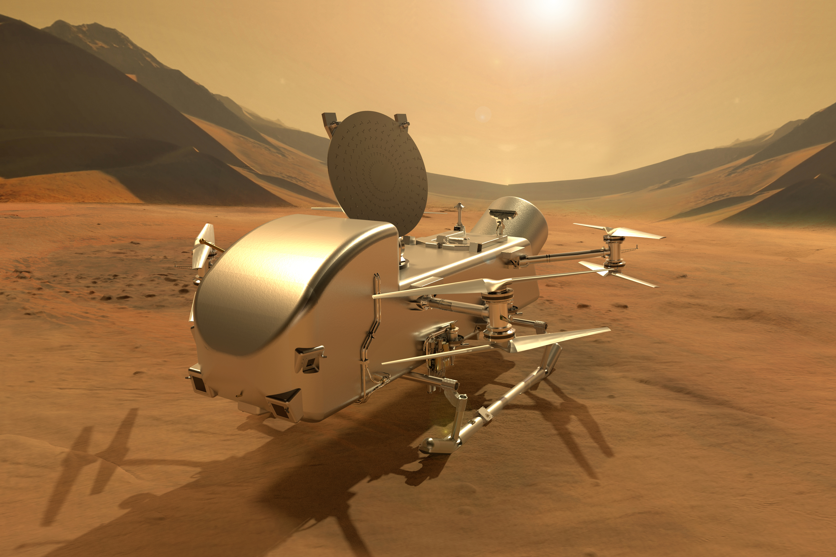 A silver drone-like rotorcraft sits on the sandy, tan surface of a planet, with shaded mountains and a hazy sky and Sun in the background
