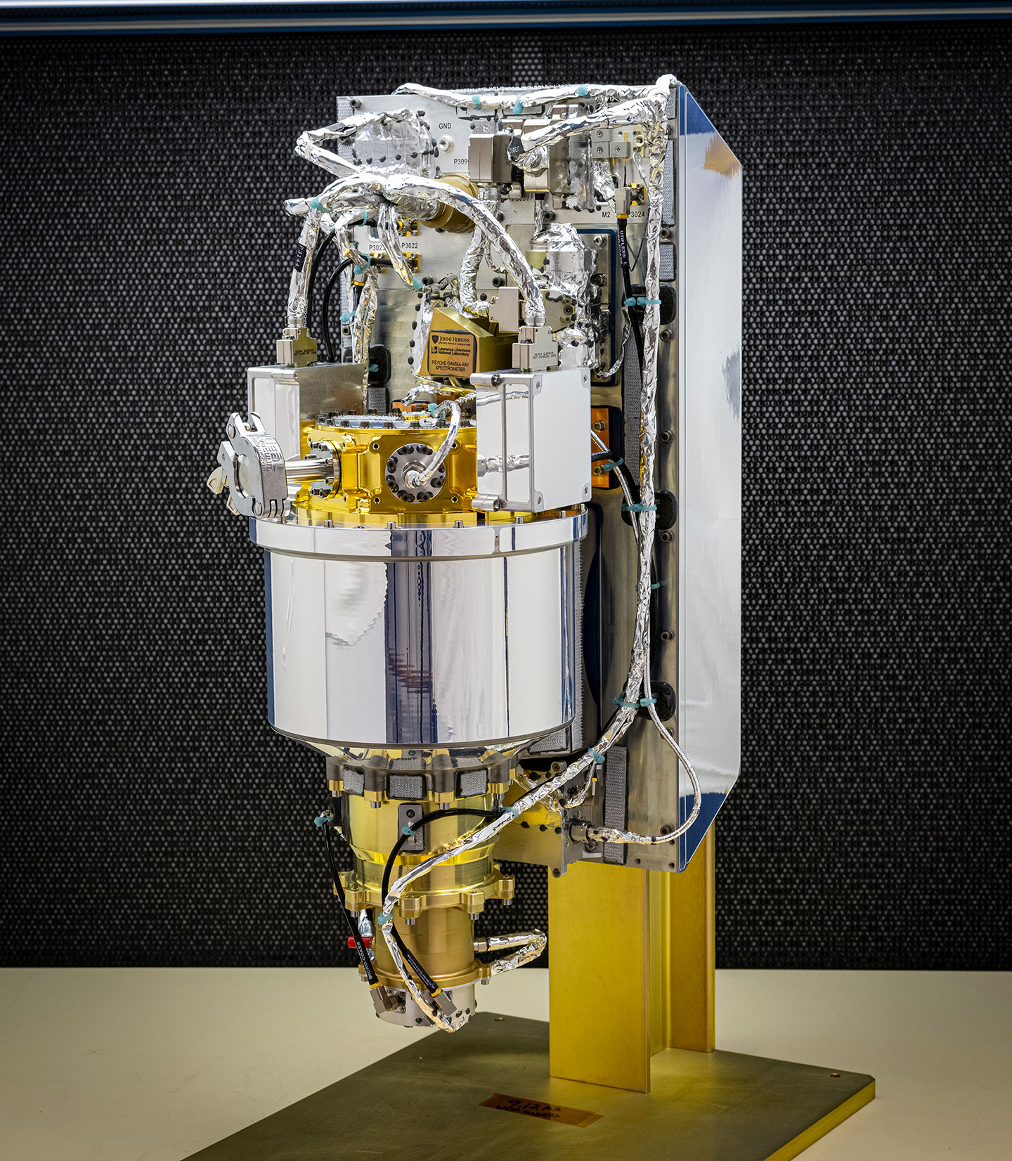 Image of a shiny, silver and gold gamma-ray spectrometer