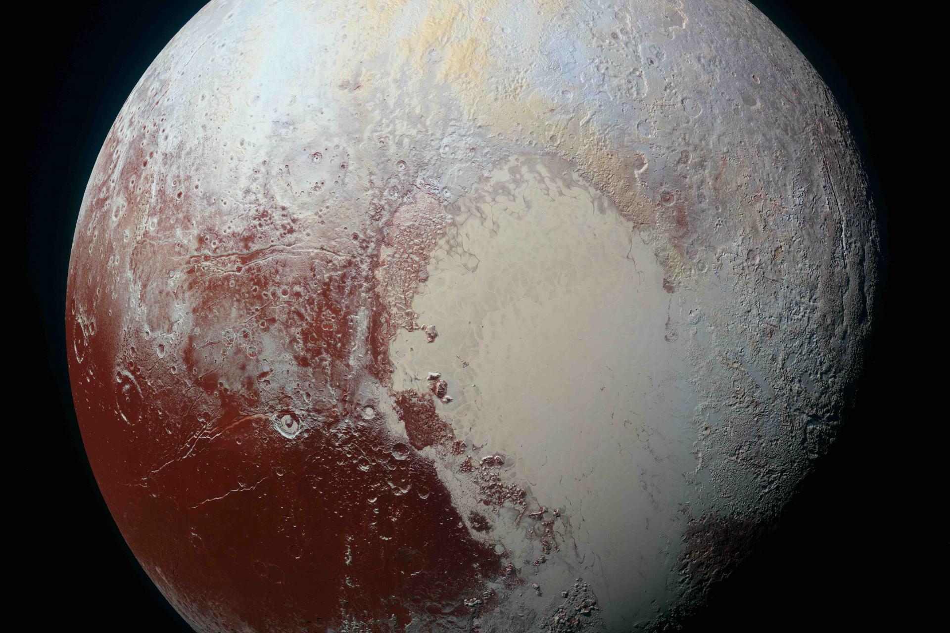 Pluto illuminated by the sun, viewed from just outside its orbit.