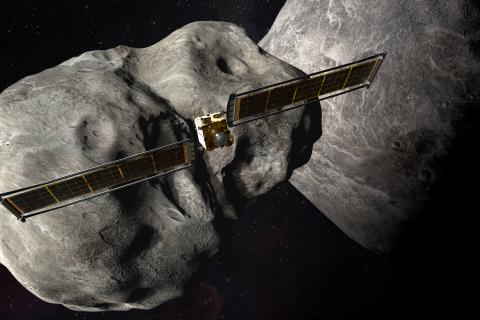 Rendering of the DART spacecraft behind two asteroids