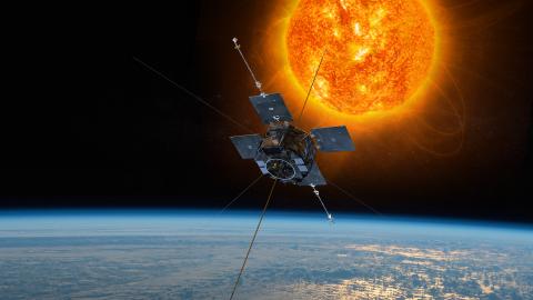 Rendering of one of the Van Allen Probes orbiting above Earth with the Sun in background