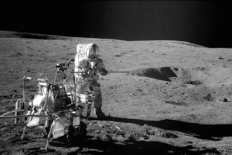 Image of Apollo 14 astronaut Alan Shepard on the Moon with equipment