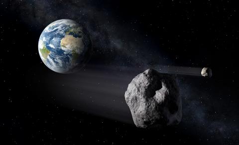 Illustration of two small asteroids flying past Earth