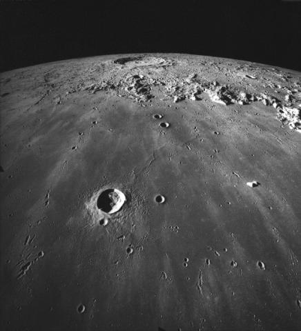 Image of the lunar surface, with craters illuminated from the left