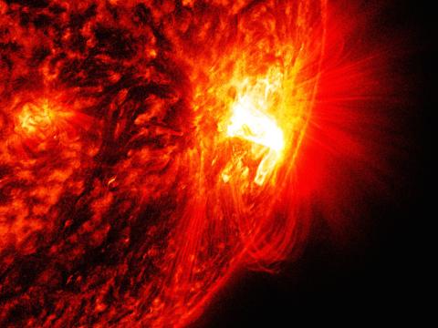 An image of the Sun's surface, showing closely the moment a bright solar flare emerged