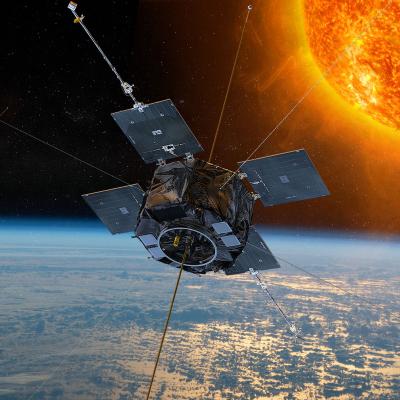 Rendering of the Van Allen Probes orbiting above Earth with the Sun in background