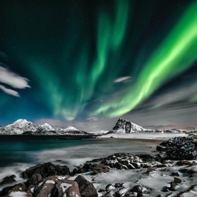 Image of auroras over a mountain scene