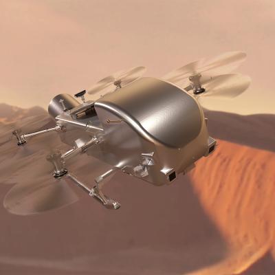 A silver dronelike rotorcraft flies over a dusty, tan-colored desert with a hazy, warm-colored background